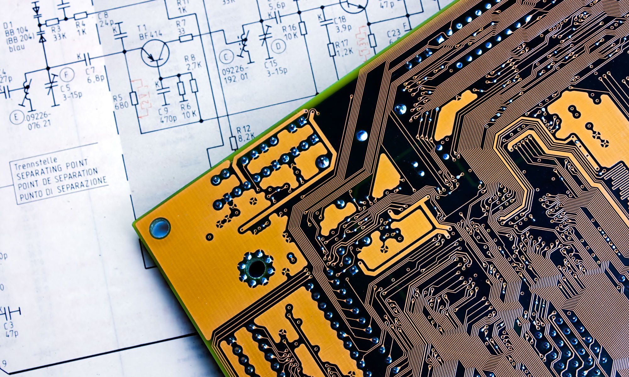 photo of schematic and bare PCB