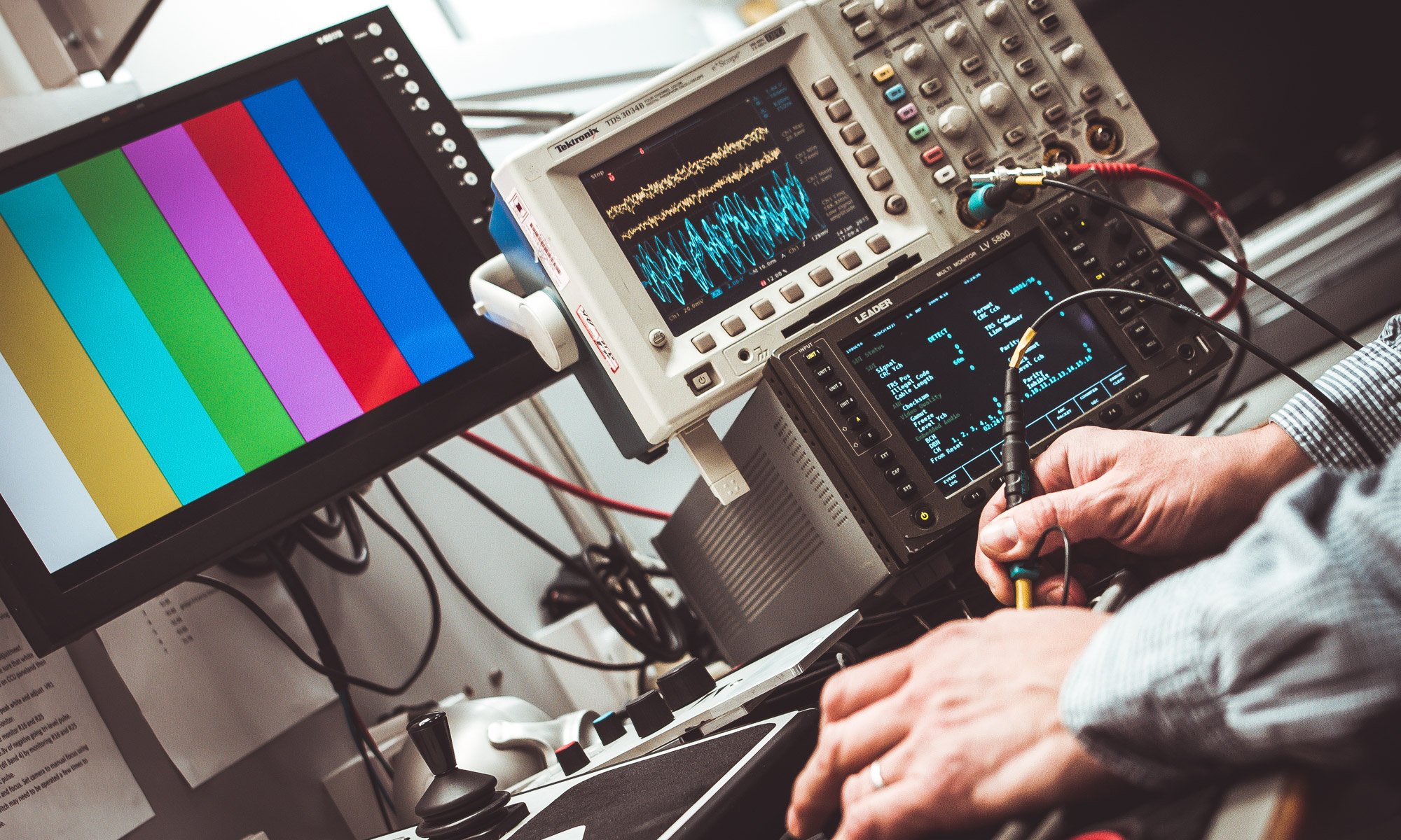 photo of oscilloscope and user